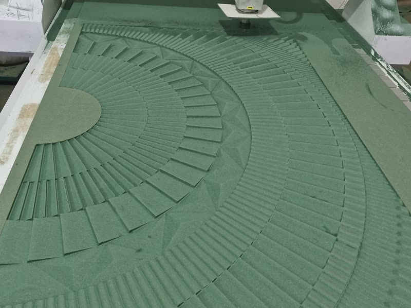 3-axis CNC router cutting a deep radial pattern into a board on the bed at Dream3 Bijwasan