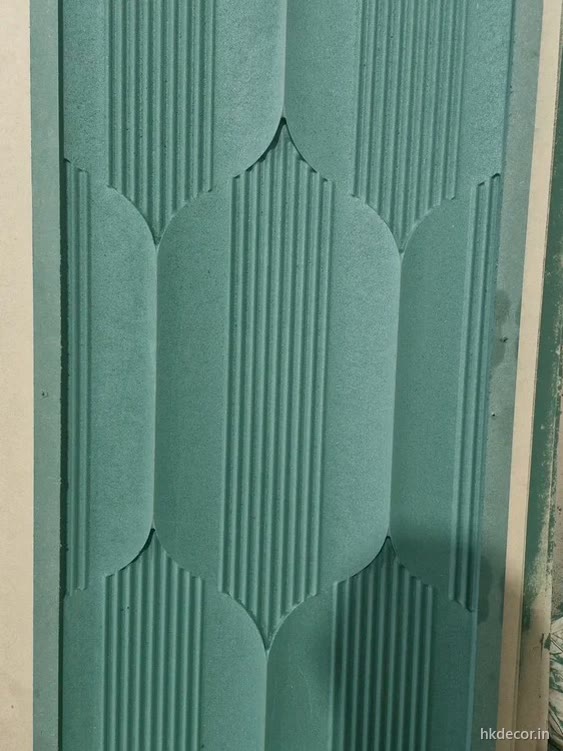 CNC carved door combining fluted grooves and faceted panels on one shutter, primed