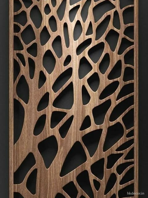 CNC cut jaali panel with a branching tree lattice set into a finished timber frame
