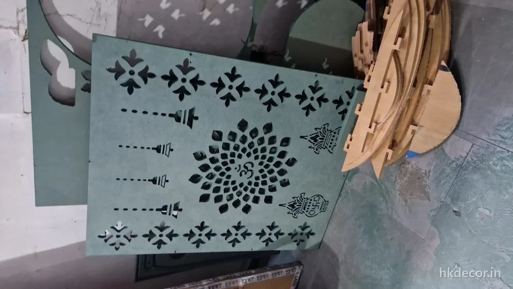 Finely perforated jaali parts cut from thin board on the CO2 laser bed at Dream3