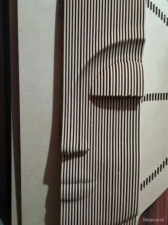 Parametric panel with a face cut into a field of vertical CNC cut ribs