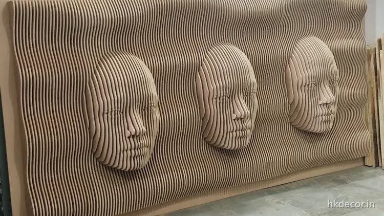 Parametric wall of stacked CNC cut ribs with three faces rising out of the surface, Dream3 Bijwasan