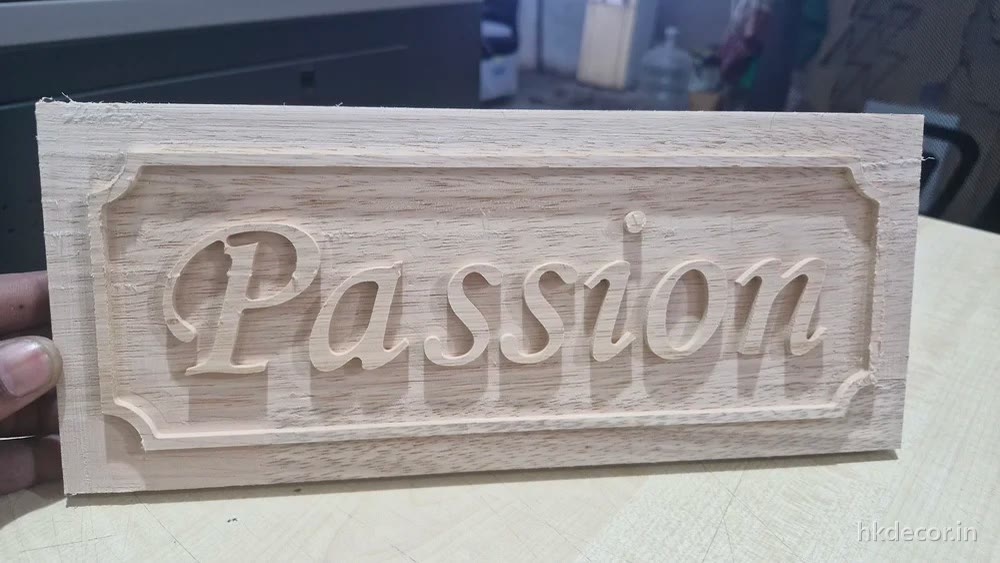 CNC carved signage block with raised lettering cut out of solid board, before finishing